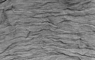 Pleated fabric background texture. pattern of fabric in the crea