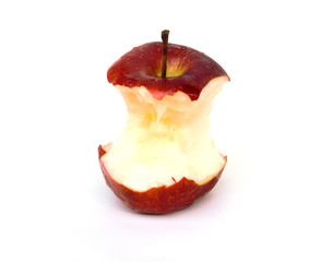 red apple eaten down to the core, on white background.