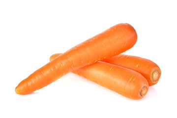 whole unpeeled carrot on white background