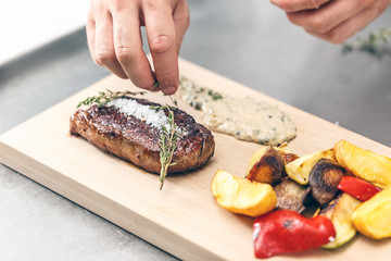 Chef serving beef steak