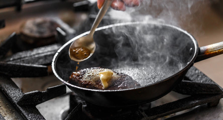 Beef meat in a frying pan