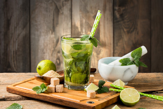 Mojito lime drink on wooden background