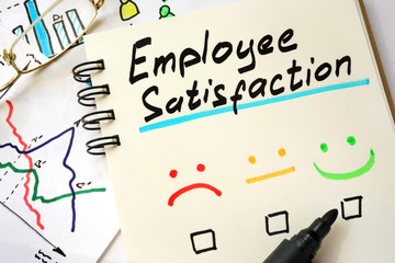 Sign employee satisfaction on a page of notebook.