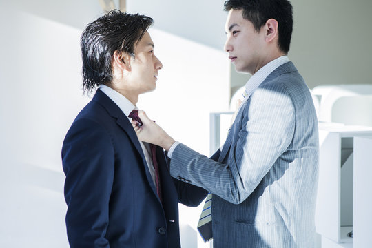 Businessmen are fights in the office