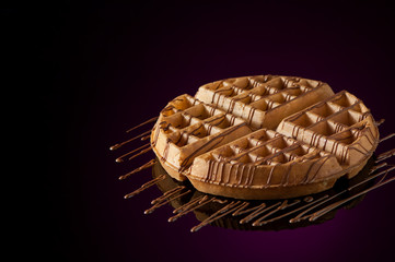 round cookies on a dark background with reflection
