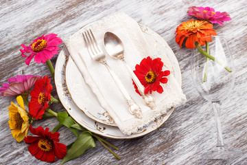 Tableware and silverware with zinnia