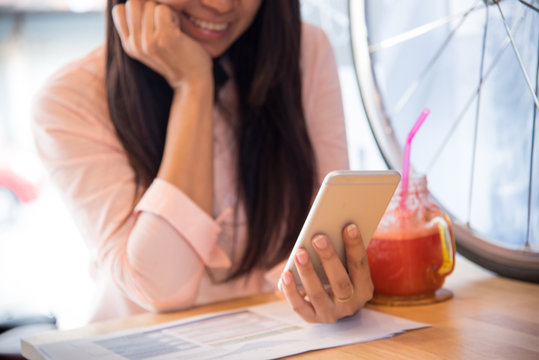 Beautiful Business Working Woman Using Iphone , Cellphone Afterwork At The Coffee Shop.