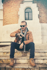 Fototapeta premium Modern guy using cellphone. 