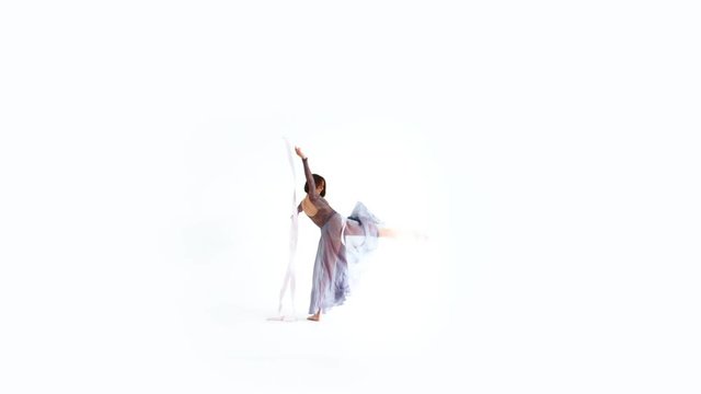 Young Woman Dancing With Gymnastic Ribbon on a White Background