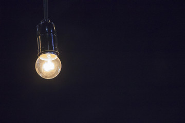 light bulb isolated black background