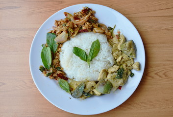 chicken in green curry and spicy minced pork salad on rice