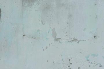 Wall fragment with scratches and cracks