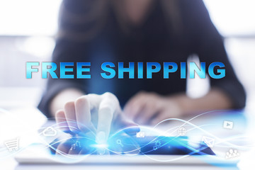 Woman is using modern tablet pc, presssing on touch screen and selecting "Free shipping".