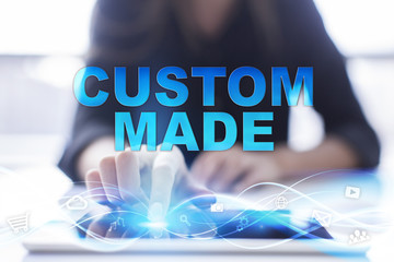 Woman is using modern tablet pc, presssing on touch screen and selecting "Custom made".