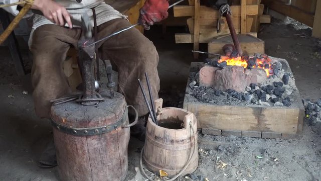 blacksmith working at smithy