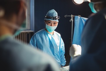 Portrait of female surgeon in operation room