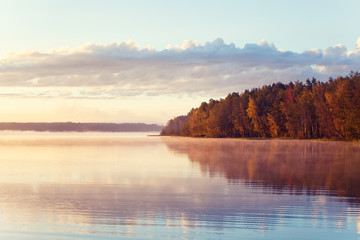 Naklejka na ściany i meble Autumn lake in sunrise