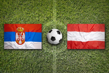 Serbia vs. Austria flags on soccer field
