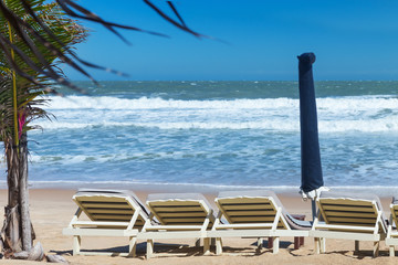 summer beach sun chairs lounger near tropical sea