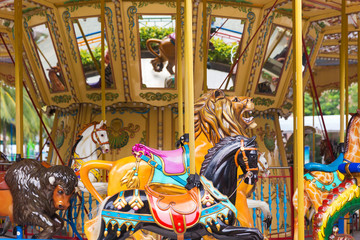 Fototapeta na wymiar Pretty carousel adventure amusement park