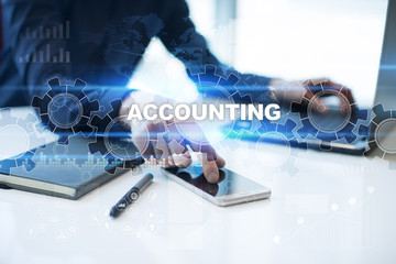 Businessman is working in office, pressing button on virtual screen and selecting "Accounting". Business concept.