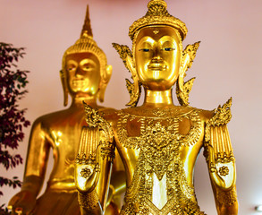 The beautiful of face buddha gold statue and thai art architecture in Wat Phra Chetupon Vimolmangklararm (Wat Pho) temple in Thailand.