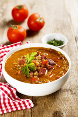 Tomato soup with lentils and sausages
