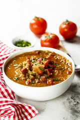 Lentil soup with tomatoes and sausages