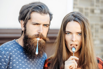 young couple with tea spoon