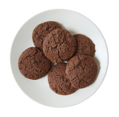 Aerial view plate of freshly balked chocolate chip biscuits isolated on a white background