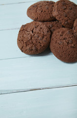 Chocolate chip cookies on a blue wooden counter top background