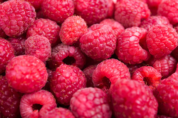 Fresh ripe raspberries macro shot, summer fruit background