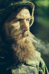 Soldier man smoking cigarette