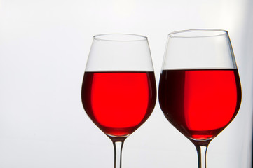 Two glasses of red wine isolated