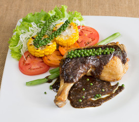 Grilled Chicken steak with black pepper sauce, In white dish on