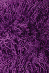 A full page of bright purple faux fur fabric background texture
