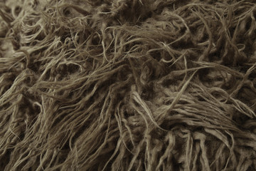 A full page of brown faux fur fabric background texture