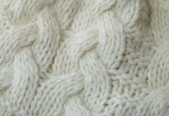 A full page of white cable knit sweater background texture