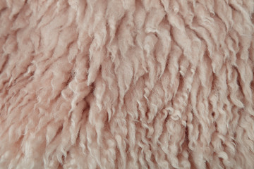 A full page of pink dyed sheepskin fleece background texture