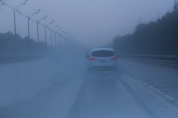 car traffic on highway in rain