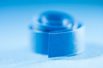 Macro, abstract, background picture of blue paper spirals on paper background
