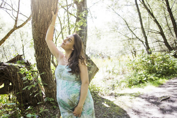 Young beautiful pregnant woman with long hair