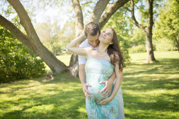 Fototapeta premium Nice Pregnant couple forest