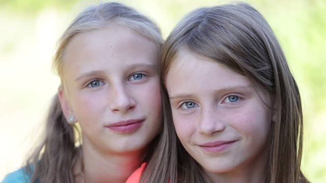 Portrait of two beautiful young girls,outdoor, portrait children close up
