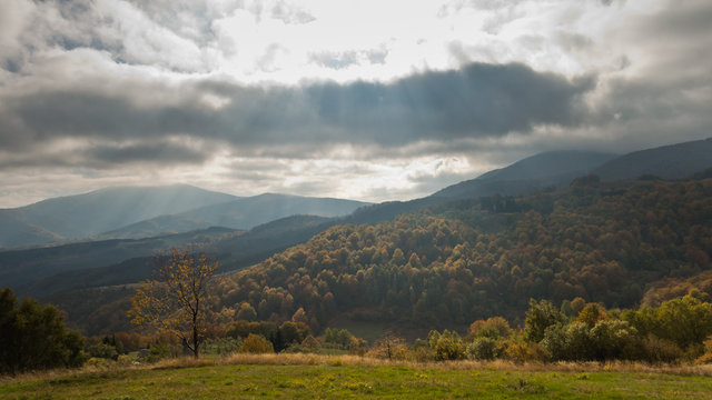 Overcast sky over meadow and forest in autumn colors, mountain Goc, Serbia