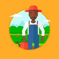 Farmer with watering can at cabbage field.