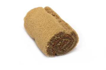 Cake roll coffee flavoured isolated on white background closeup
