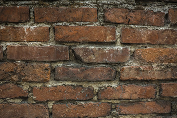 Obraz premium Old wall of red briks. Red brick wall. Wallpaper of ordinary building wall texture. Tiles