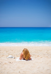 WOman on The famous Navagio Shipwreck beach in Zakynthos island