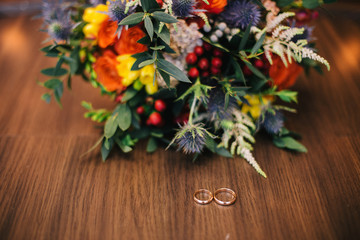Wedding rings on wooden background